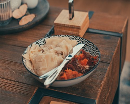 Brown rice and sweet potatoes on a wooden table